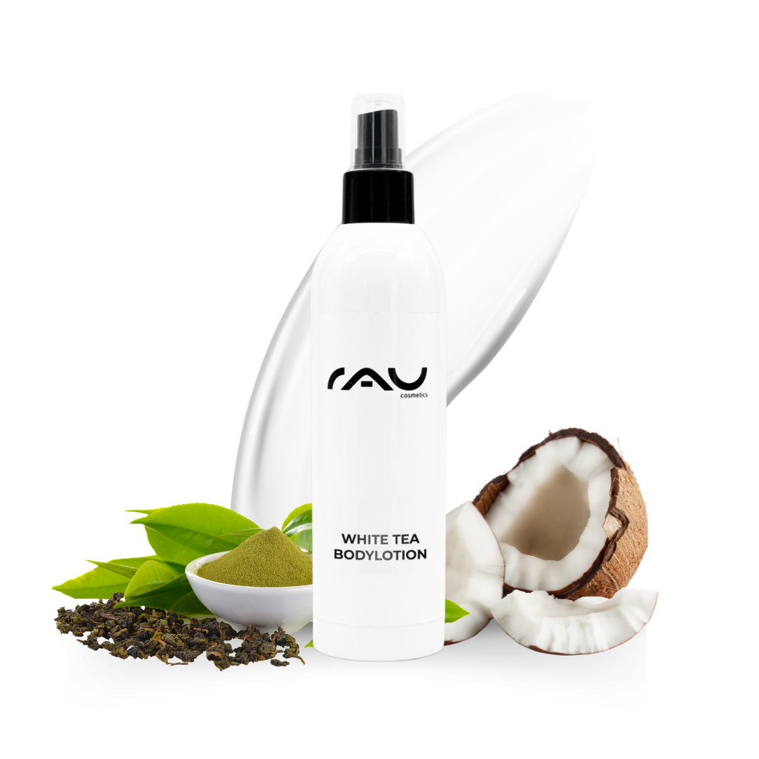 White Tea Body Lotion bottle with RAU logo, surrounded by green tea leaves, green powder, and coconut, highlighting the moisturizing and nourishing properties for dry skin.