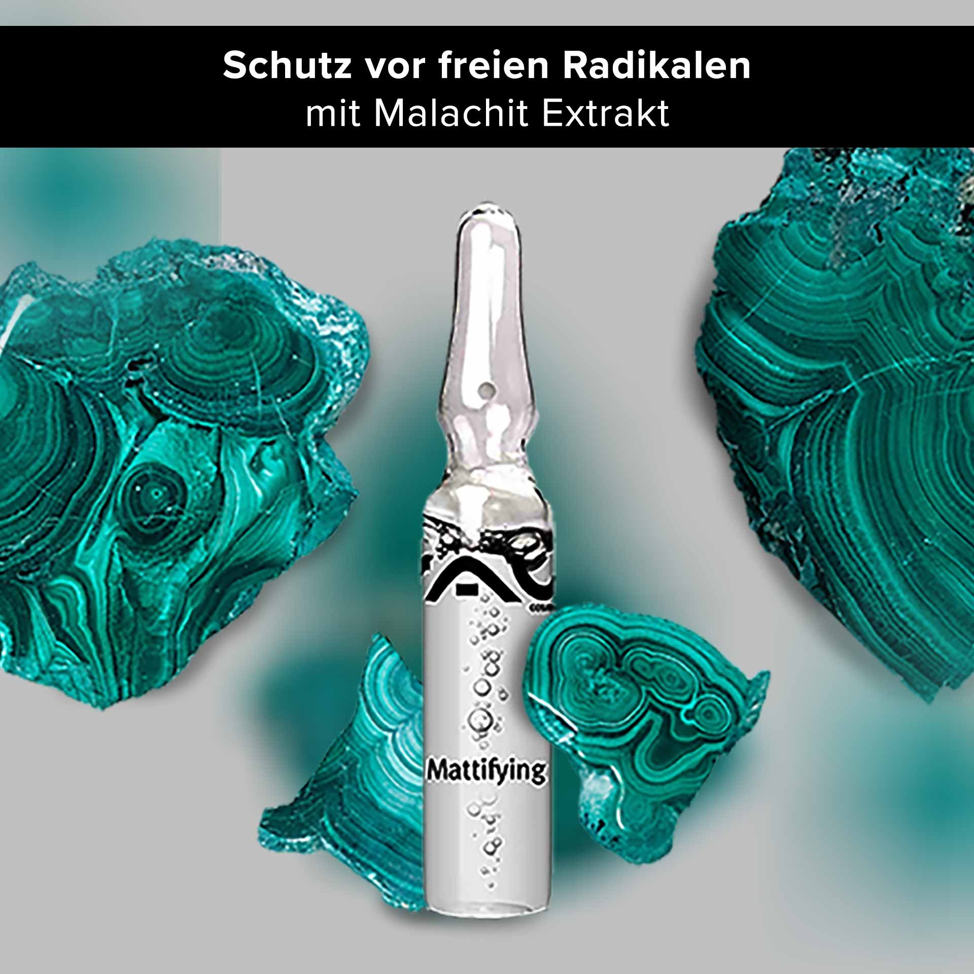 Ampoule for mattifying skincare with malachite extract, surrounded by malachite-colored minerals, emphasizing benefits against free radicals and skin impurities.