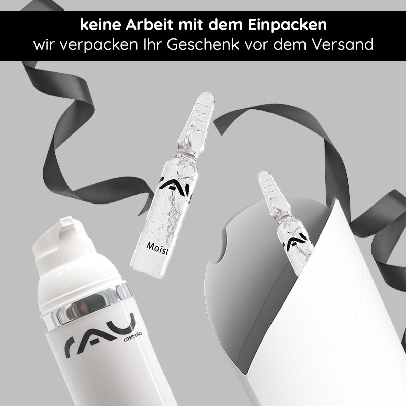 Caja de regalo "Pillow" con lazo negro Geschenkverpackung mit schwarzer Schleife und RAU Cosmetics Produkten, inklusive einer Ampulle mit "Moist"-Label und einem weißen Behälter, ideal für besondere Anlässe.